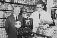 Geoffrey and Keith Gunton grinding coffee for a newspaper article in the 1960's.
